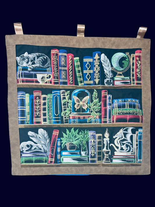 Embroidered bookshelf wall hanging